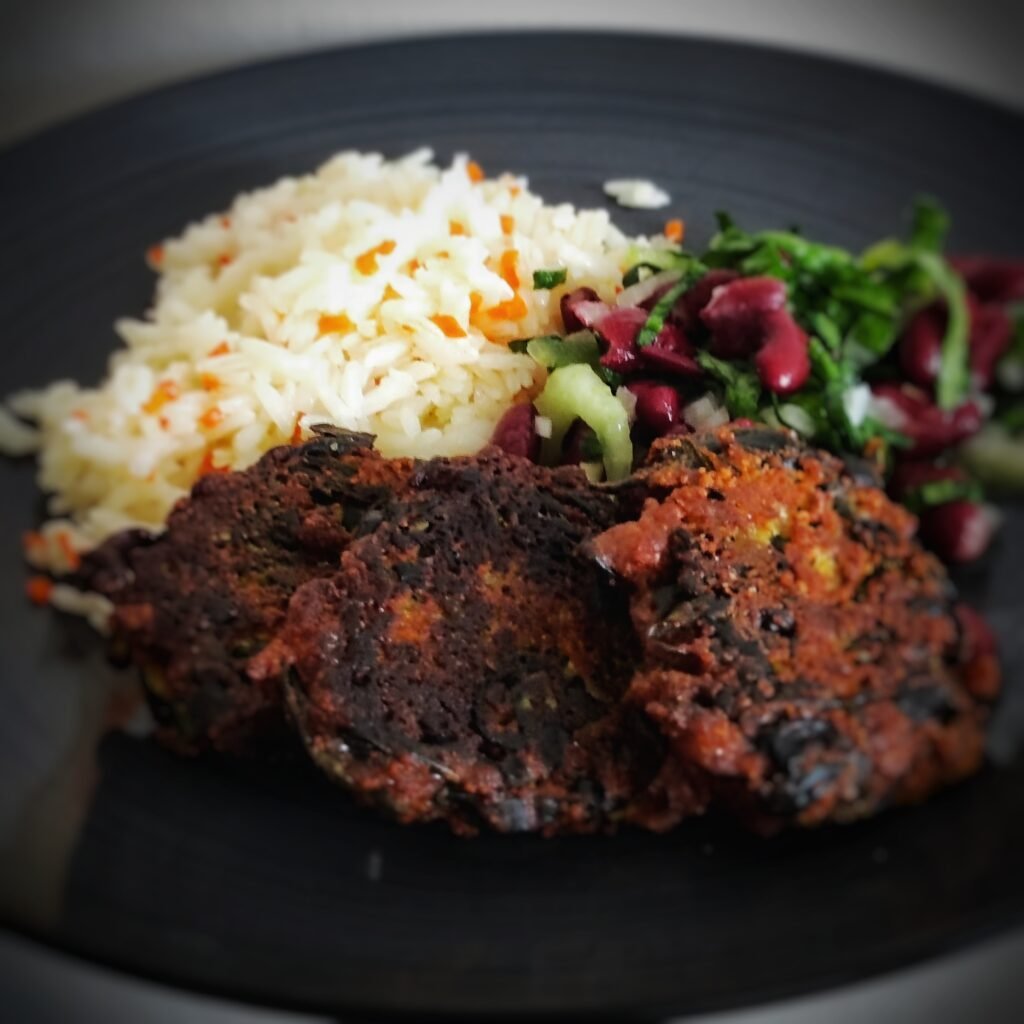 a plate of food on a black surface